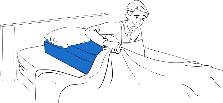 Post-shoulder surgery patient resting in own bed with Restore You Therapeutic Support positioning system and immobilization sling