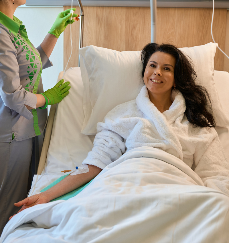 Patient receiving clinical care in hospital setting - demonstrating the medical-grade quality and professional trust behind Restore You therapeutic support pillow for sleep apnea and surgical recovery