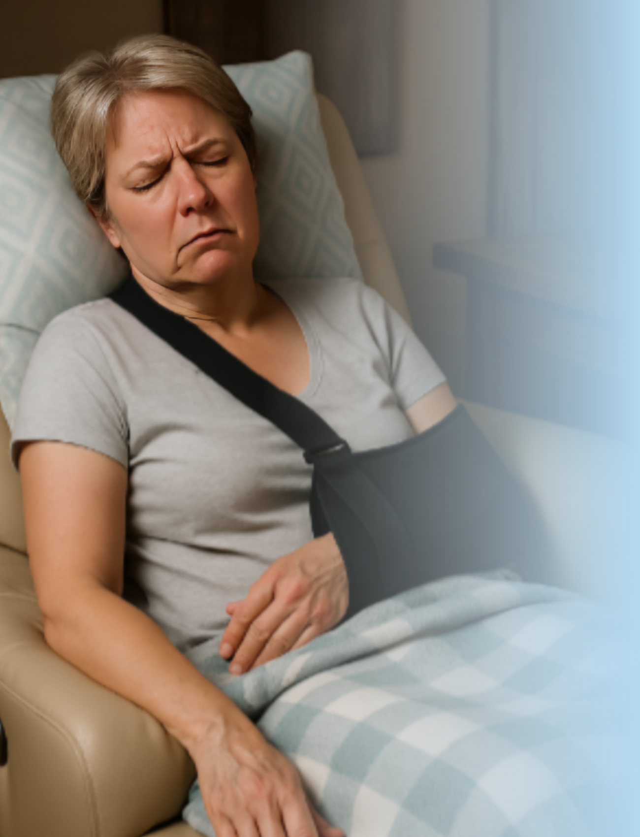 Woman experiencing discomfort and exhaustion during shoulder surgery recovery while wearing arm sling, illustrating the sleep challenges patients face without proper positioning support