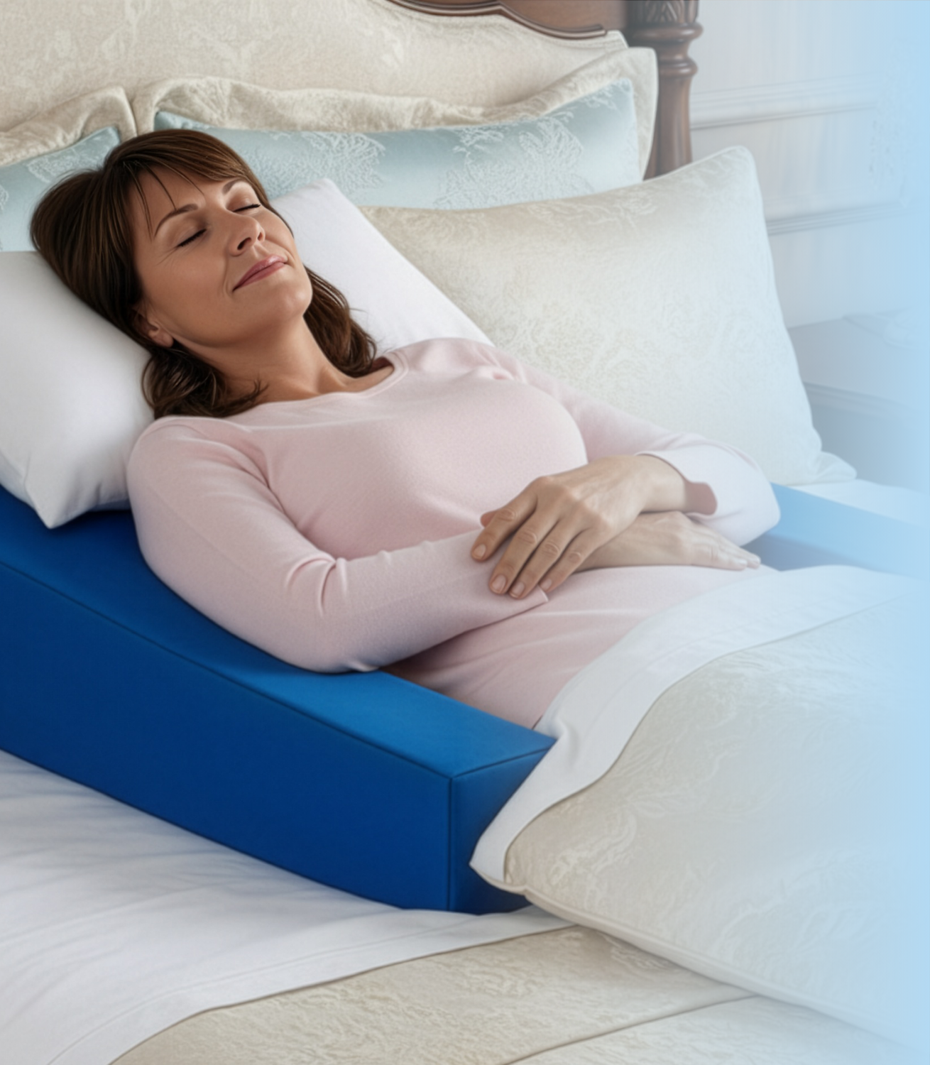 Woman peacefully sleep in your own bed after shoulder surgery with Restore You therapeutic support pillow providing elevated positioning