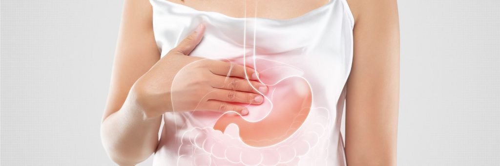 Woman experiencing acid reflux symptoms showing need for wedge pillow for acid reflux relief and GERD management