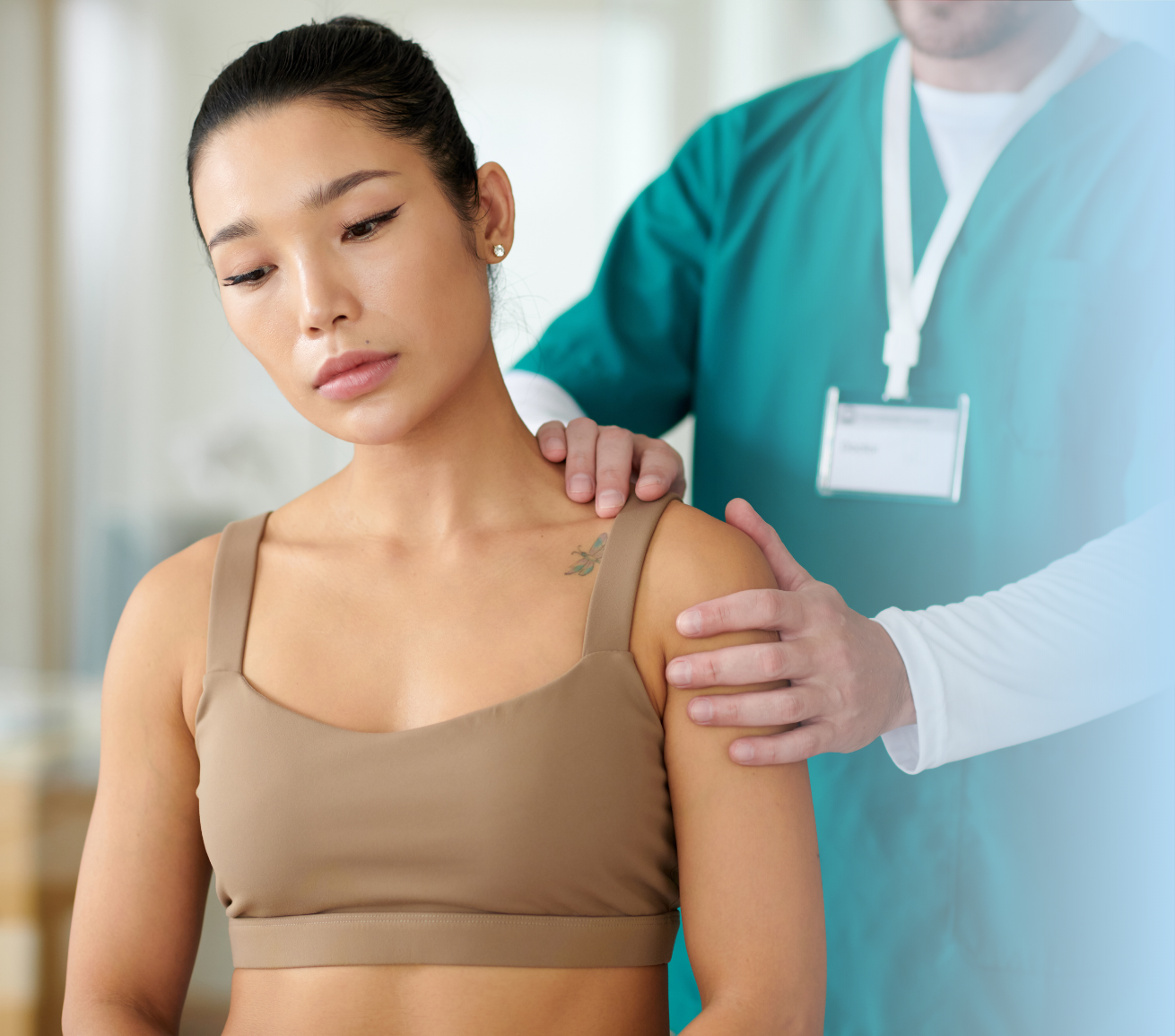 Healthcare professional examining patient's shoulder to assess benefits of proper post-surgery recovery support positioning