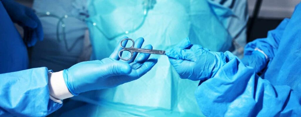 Surgical team during breast surgery procedure preparing for patient sleep after breast surgery recovery