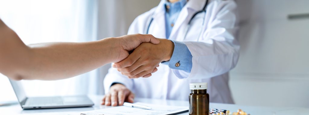 Healthcare professional recommending clinical-grade sleep apnea pillow to patient - medical consultation for sleep restoration solutions